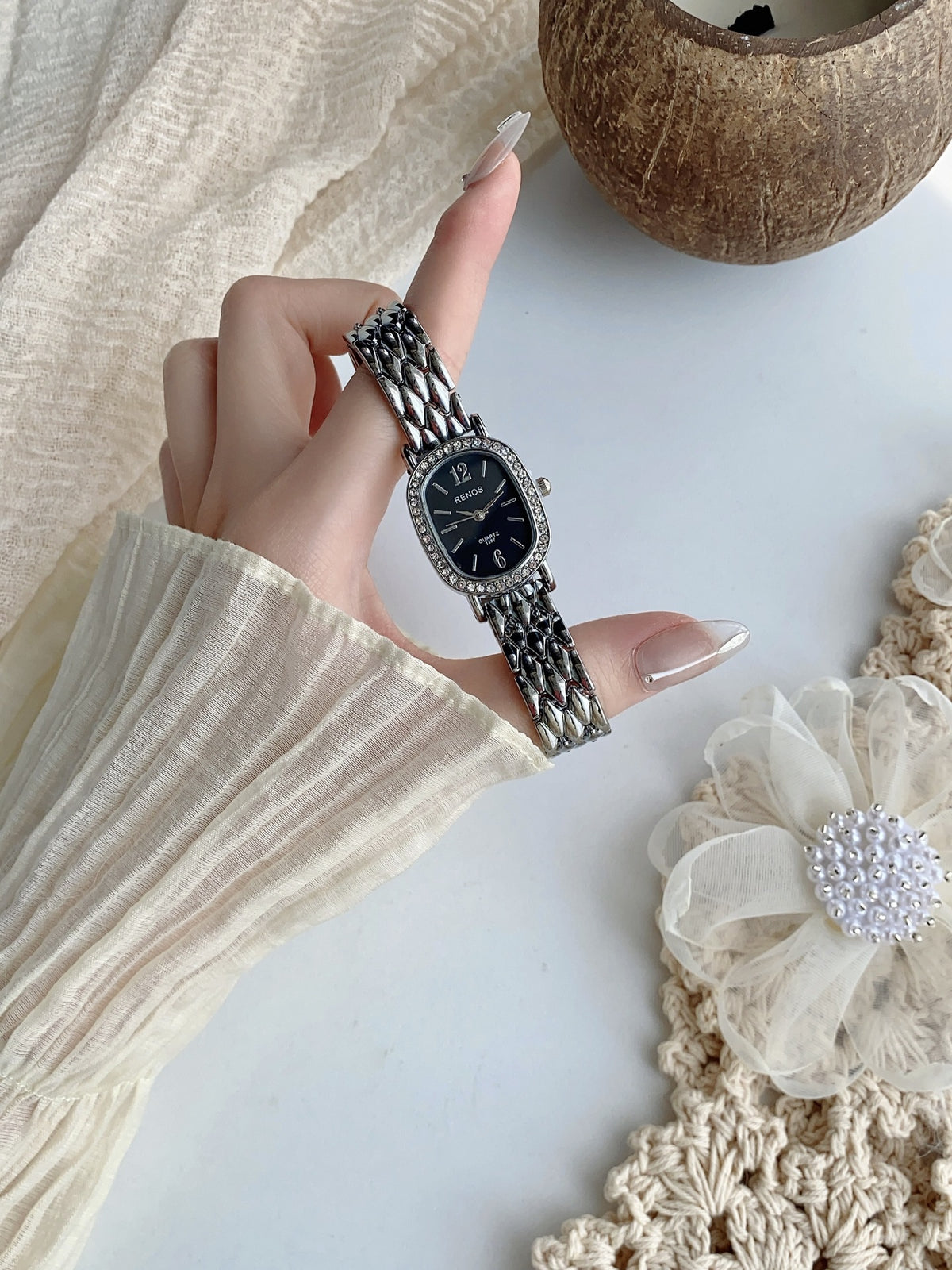 RENOS crystal-style cushion watch in silver tone with black dial