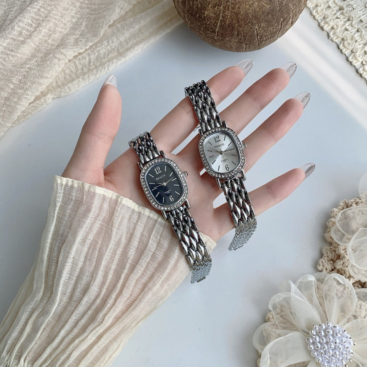 RENOS crystal-style cushion watches in silver tone with black and white dials
