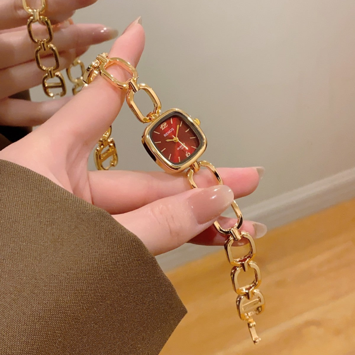 RENOS open-link cushion bracelet watch in gold tone with red dial
