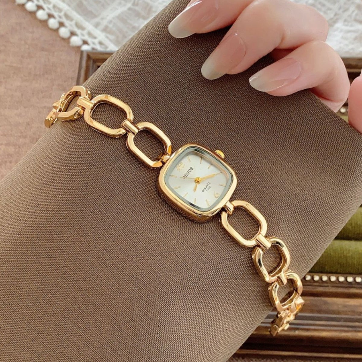 RENOS open-link cushion bracelet watch in gold tone with white dial