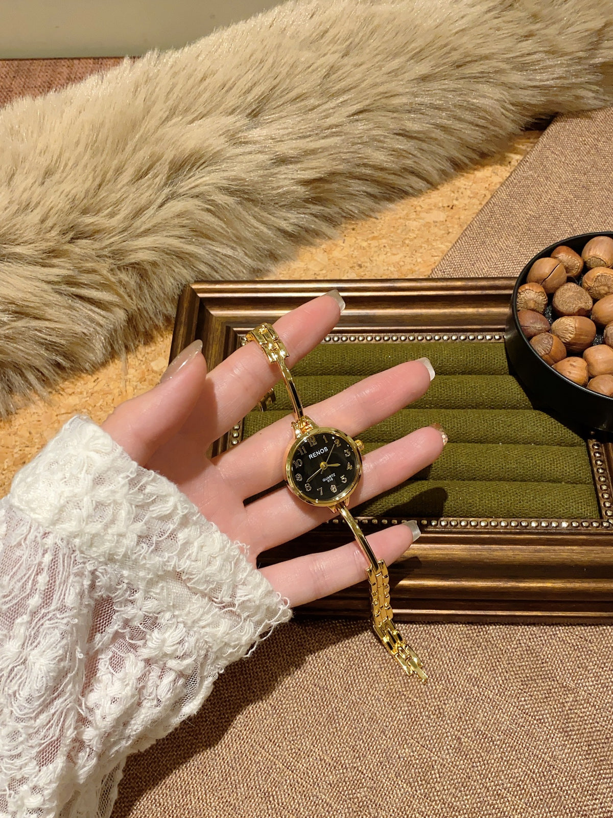 RENOS petite round bar-link bracelet quartz watch in gold tone with black dial