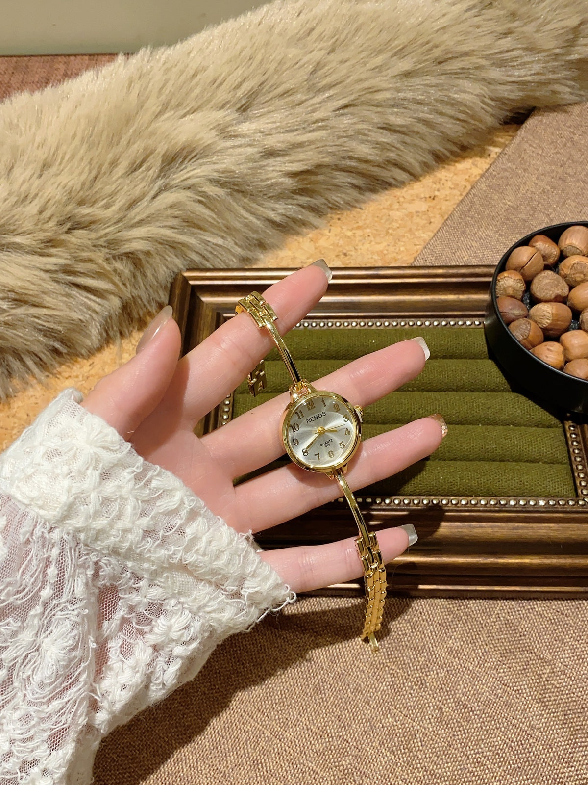 RENOS petite round bar-link bracelet quartz watch in gold tone with silver-white dial