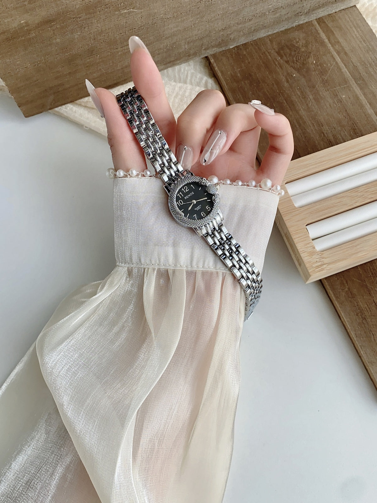 RENOS textured bezel bracelet watch in silver tone with black dial