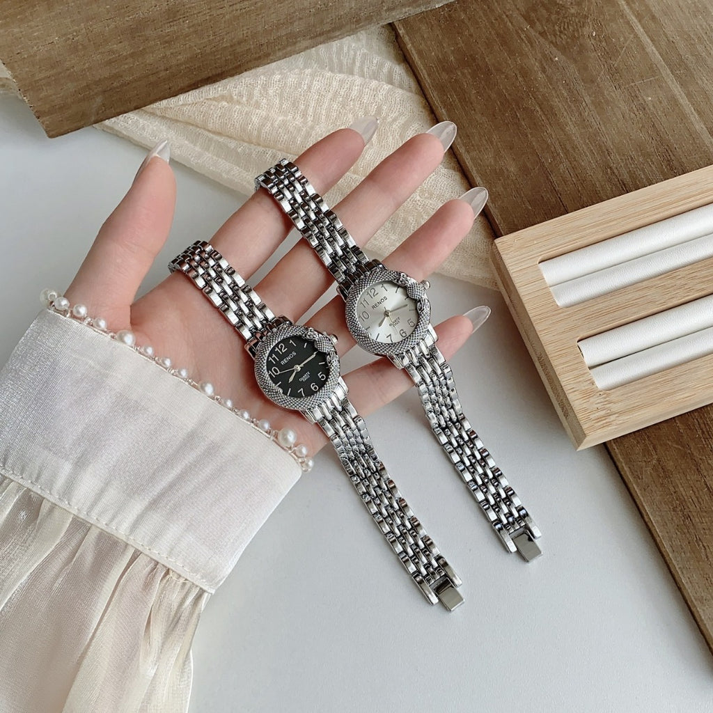 RENOS textured bezel bracelet watches in silver tone with black and white dials