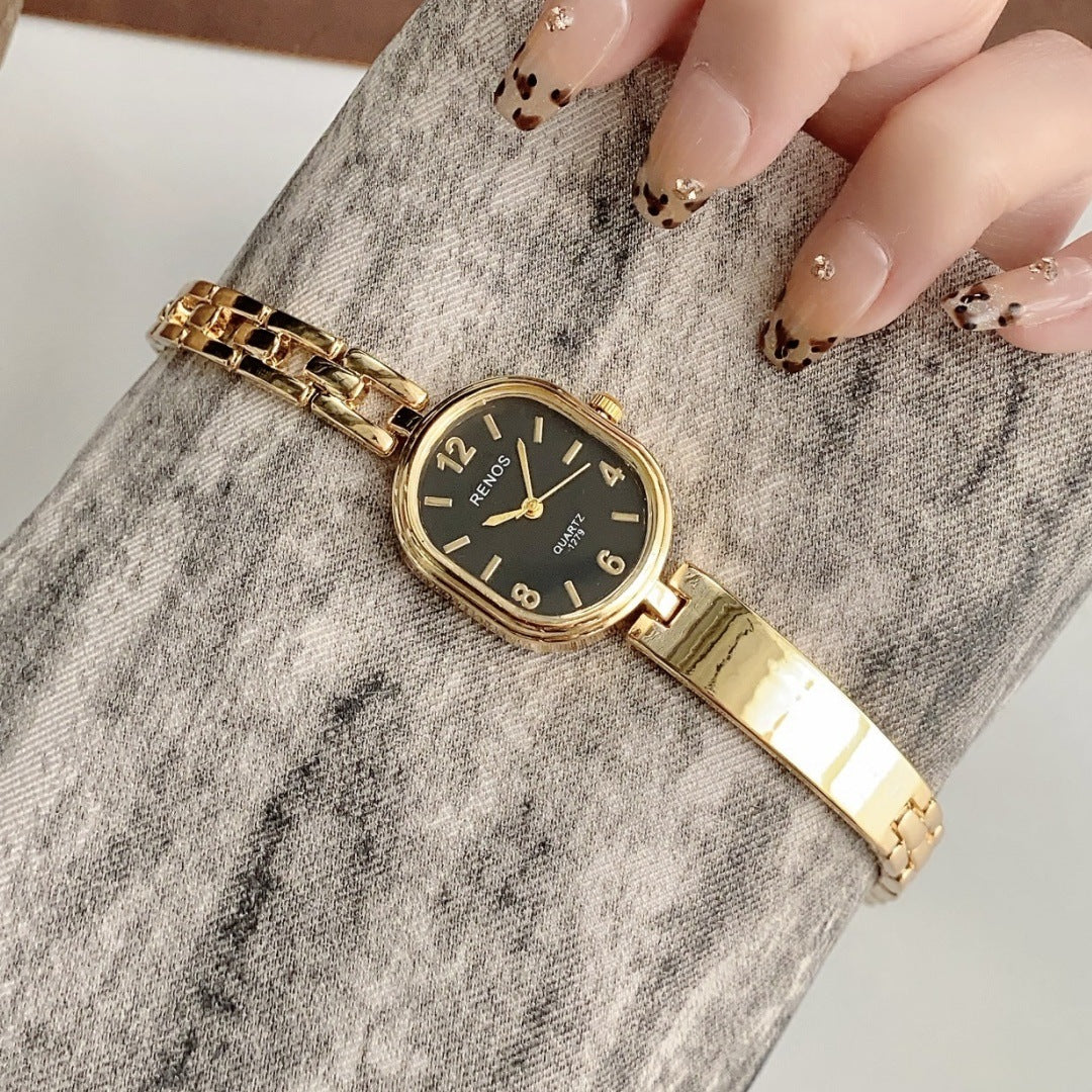 RENOS vintage cushion-link bracelet quartz watch in gold tone with black dial