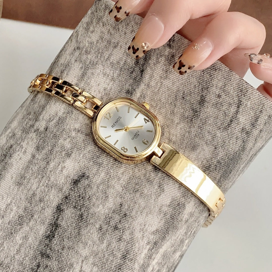 RENOS vintage cushion-link bracelet quartz watch in gold tone with white dial