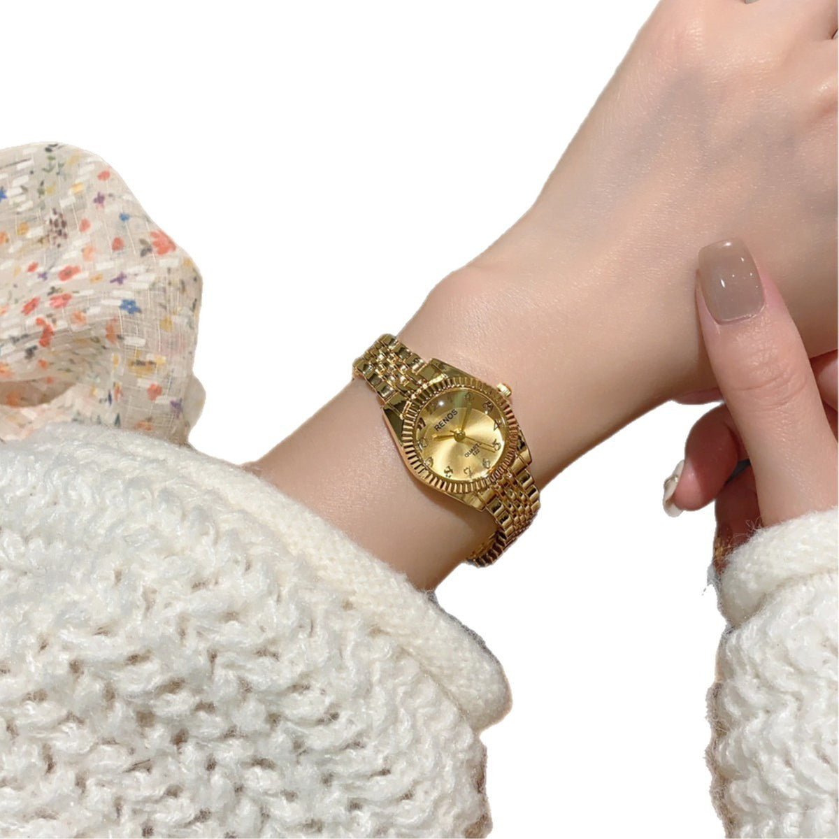 RENOS vintage gold-tone jewelry bracelet quartz watch with gold dial on wrist