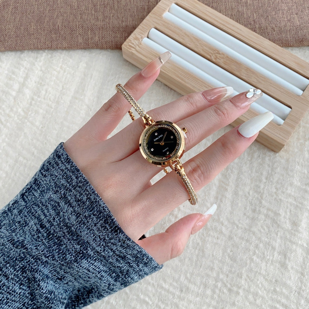 SUNLIFEX adjustable chain bracelet watch in gold tone with black dial