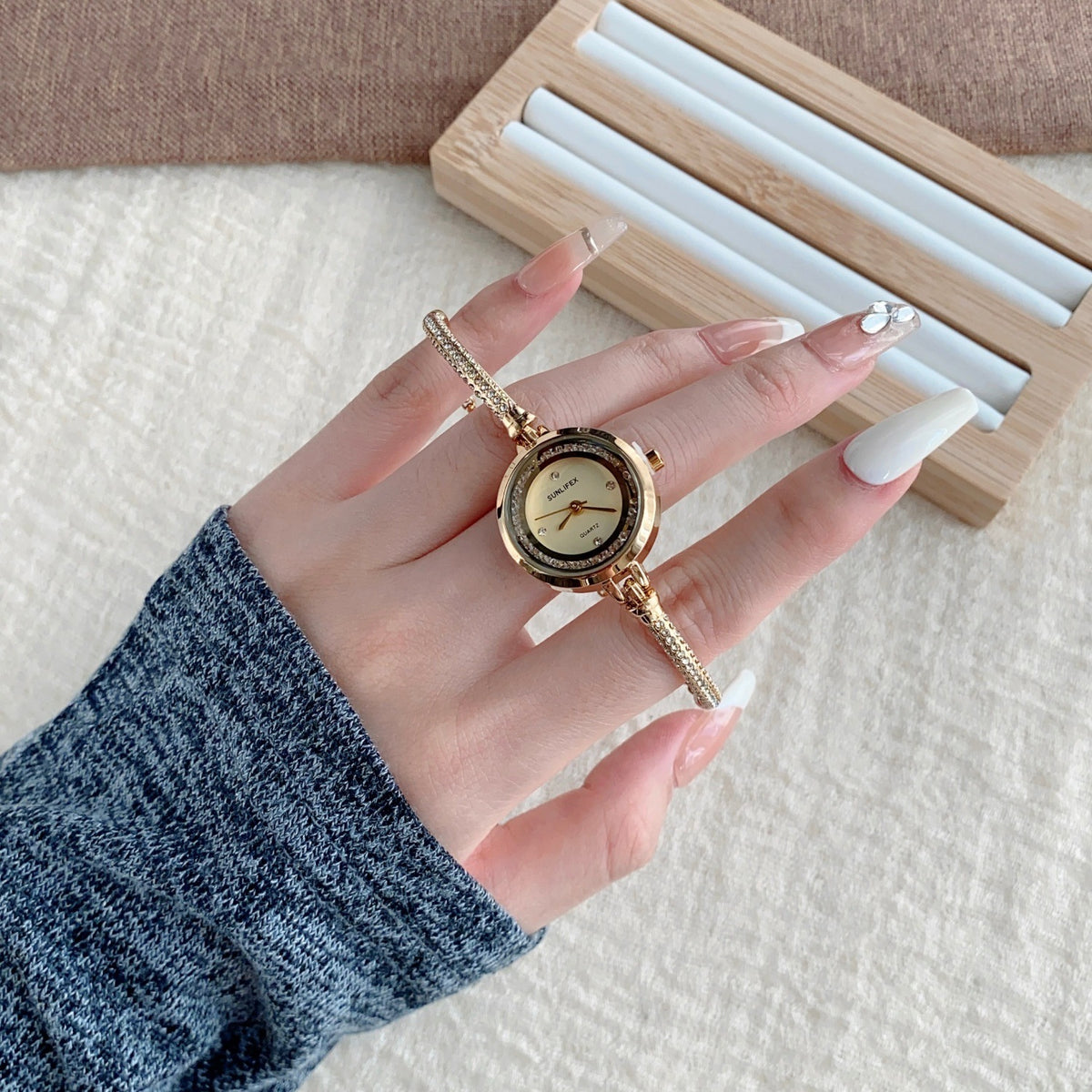 SUNLIFEX adjustable chain bracelet watch in gold tone with champagne dial