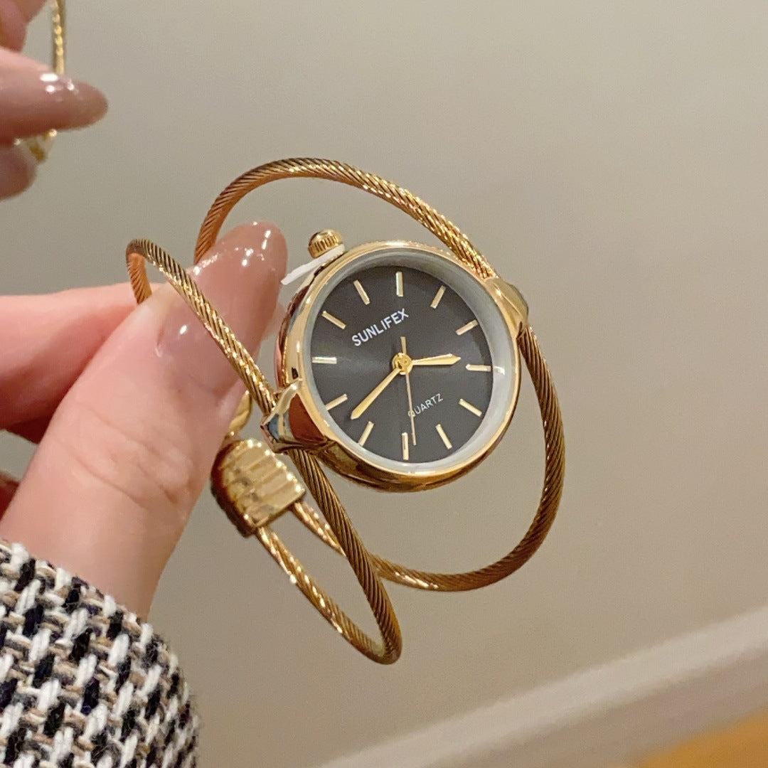 SUNLIFEX women's open bangle quartz watch in gold tone with black dial