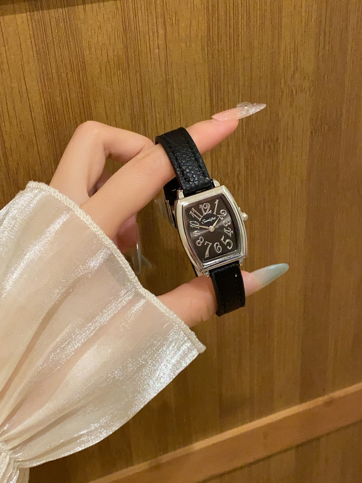 Vintage tonneau women's watch with black leather strap