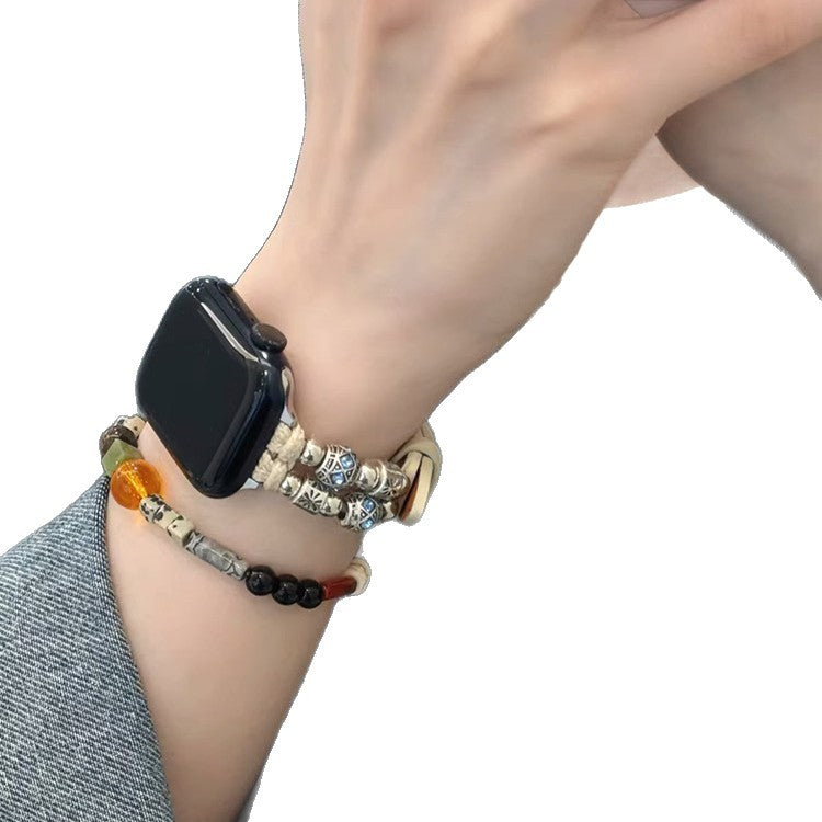 Ivory beaded leather Apple Watch band worn on wrist