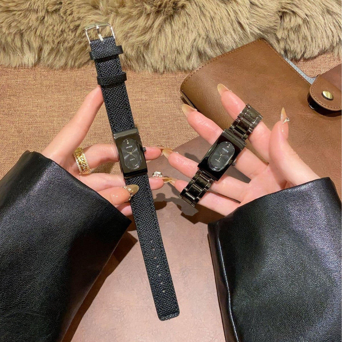 Vintage petite black tonneau women's quartz watch shown with leather-style strap and black metal bracelet
