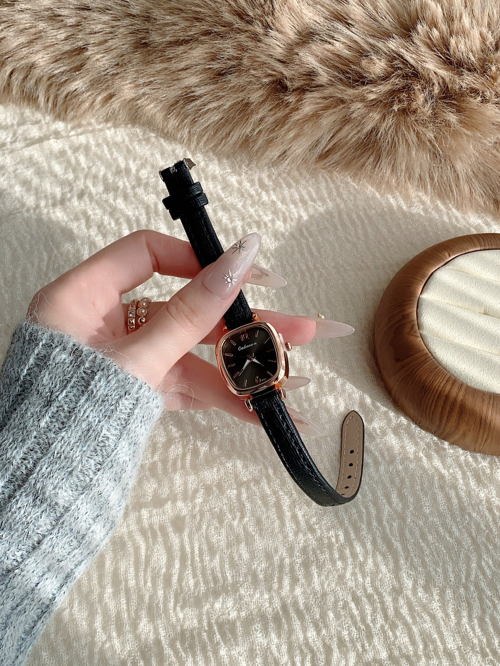 Vintage women's cushion case quartz watch with black leather-style strap alternate view