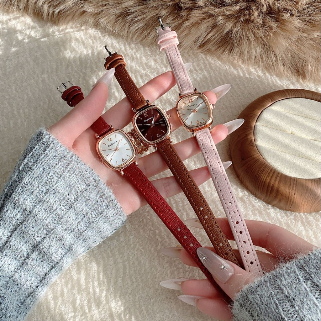 Vintage women's cushion case quartz watch shown in red, brown and pink leather-style straps
