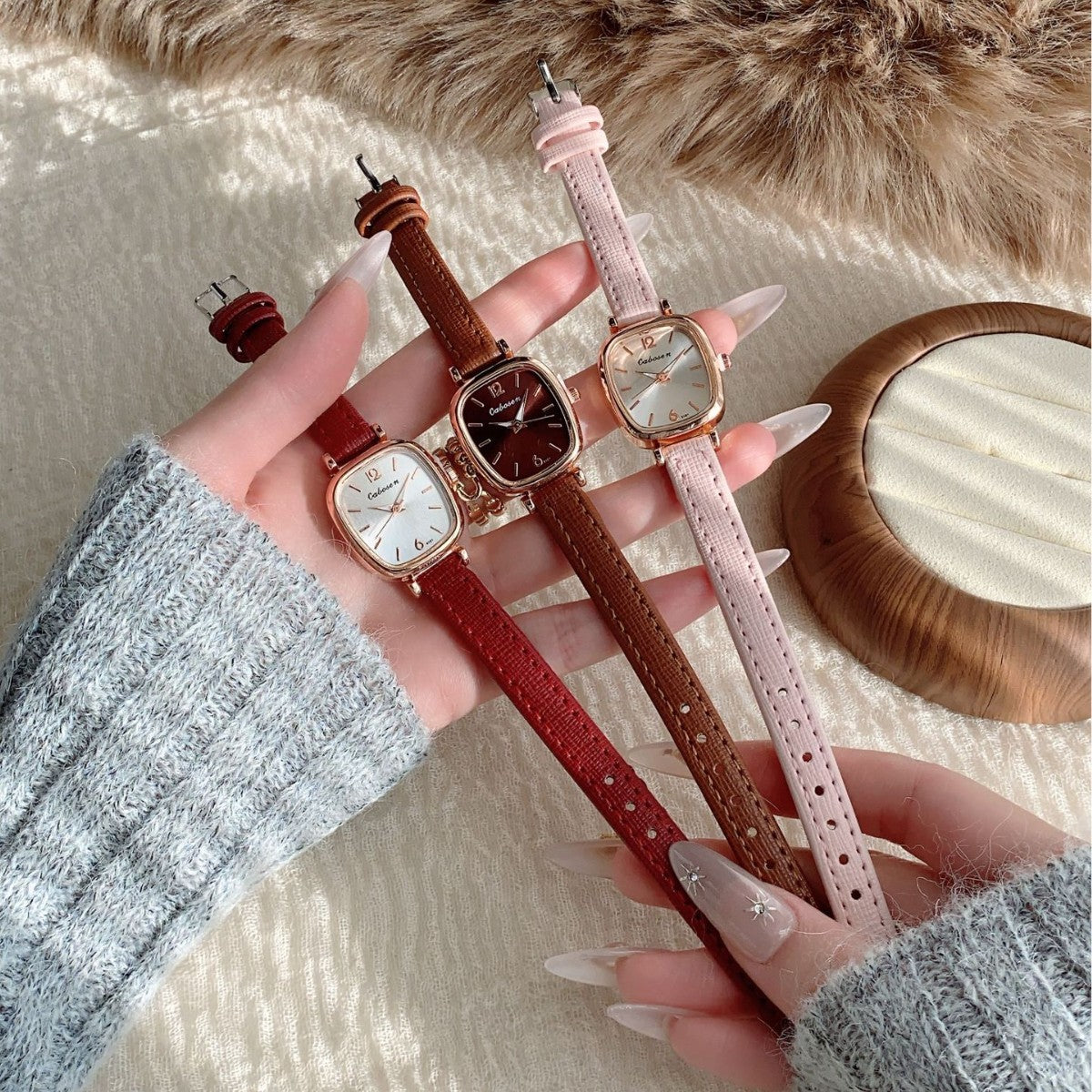 Vintage women's cushion case quartz watch shown in red, brown and pink leather-style straps