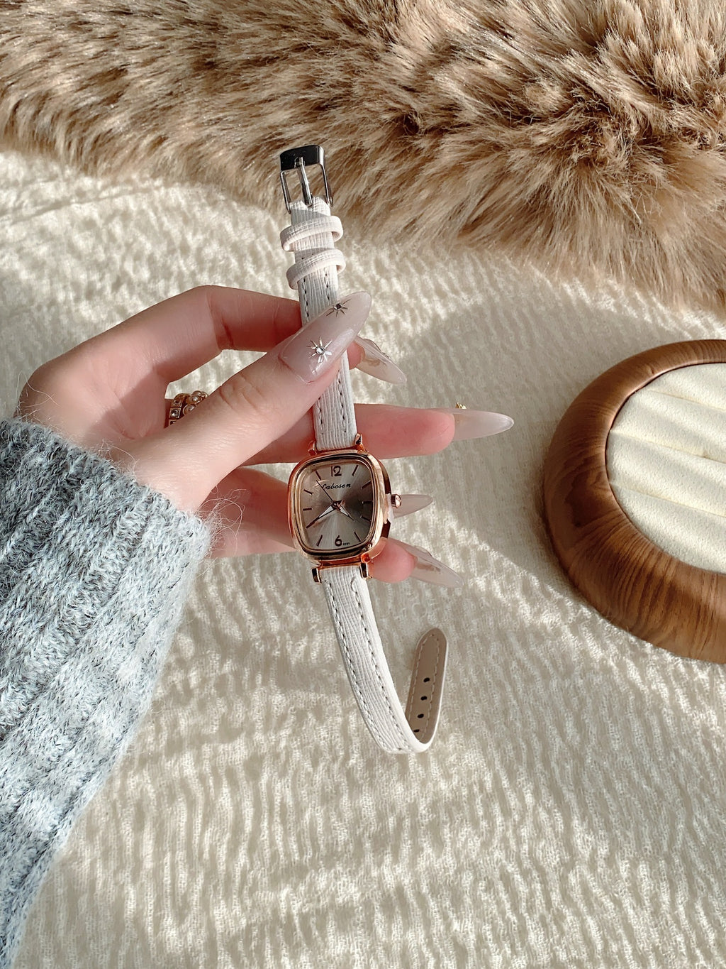 Vintage women's cushion case quartz watch with white leather-style strap alternate view