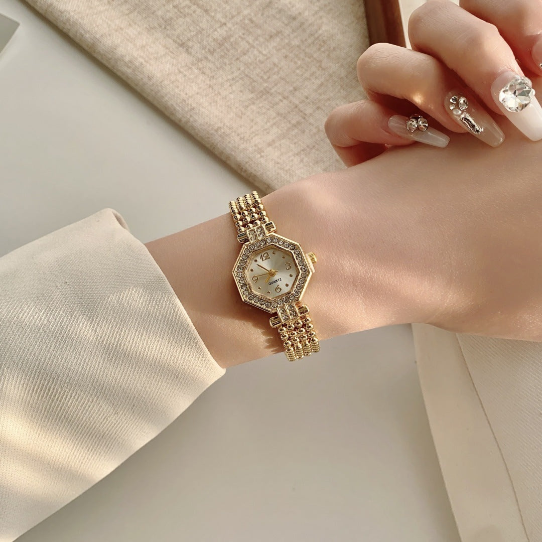 Women's vintage gold-tone jewelry watch with crystal-style octagonal case