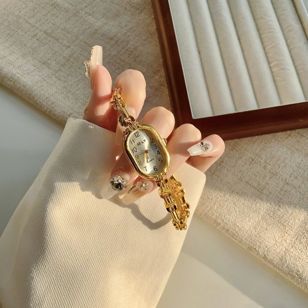 Women's vintage gold-tone oval jewelry bracelet quartz watch