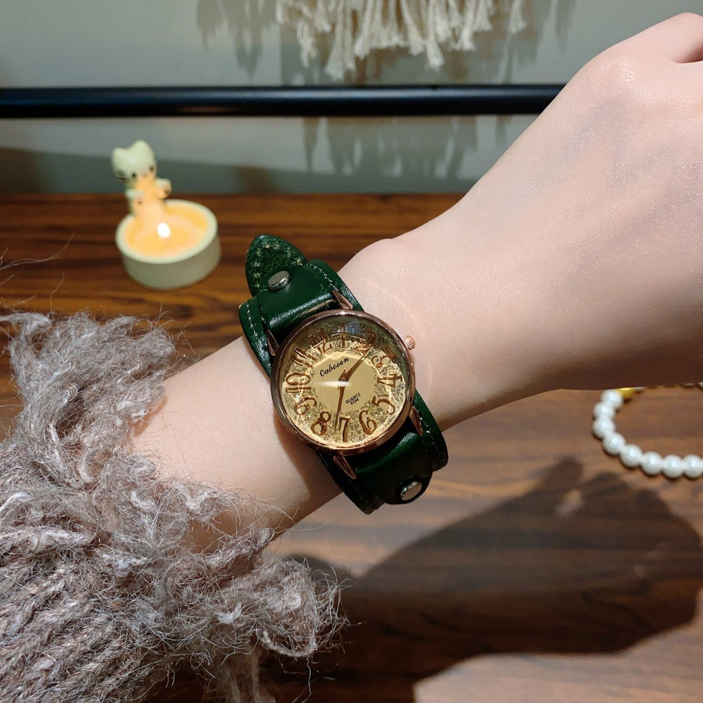 Vintage rivet leather strap unisex watch with green strap and champagne Arabic numeral dial on wrist