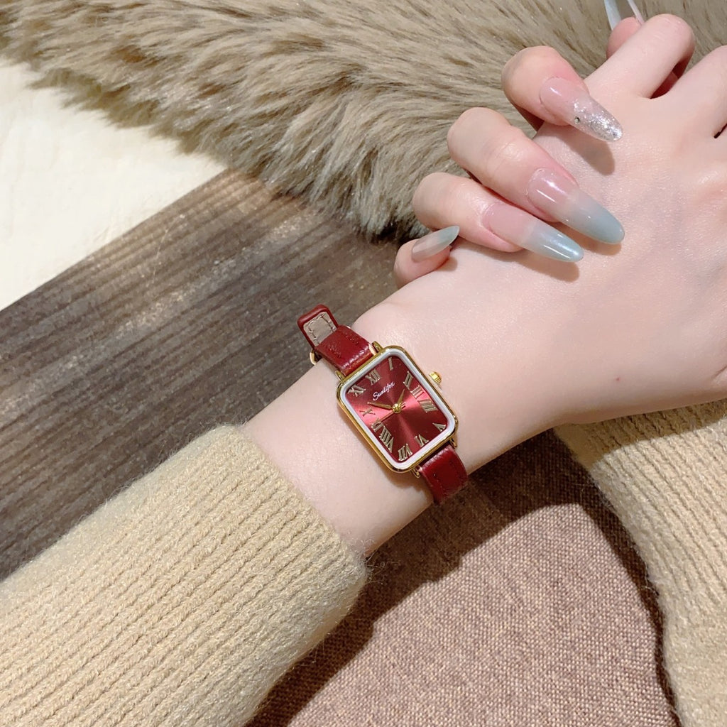 Red vintage rectangular women's watch styled on wrist