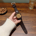 Vintage Roman numeral rivet women's watch with brown leather-style strap and cream dial
