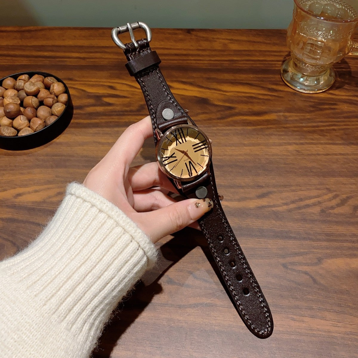 Vintage Roman numeral rivet women's watch with brown leather-style strap and cream dial