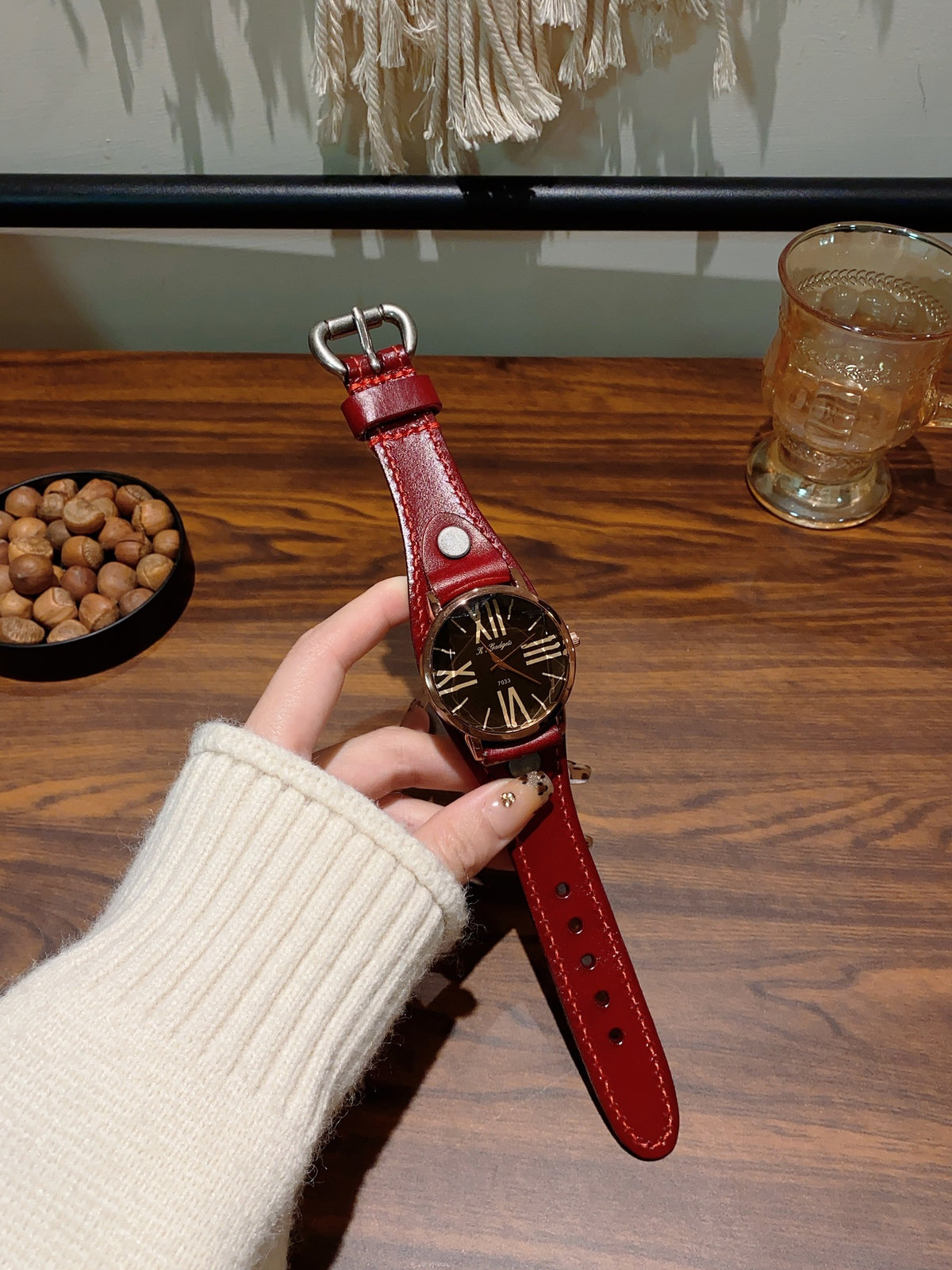 Vintage Roman numeral rivet women's watch with red leather-style strap and black dial alternate view