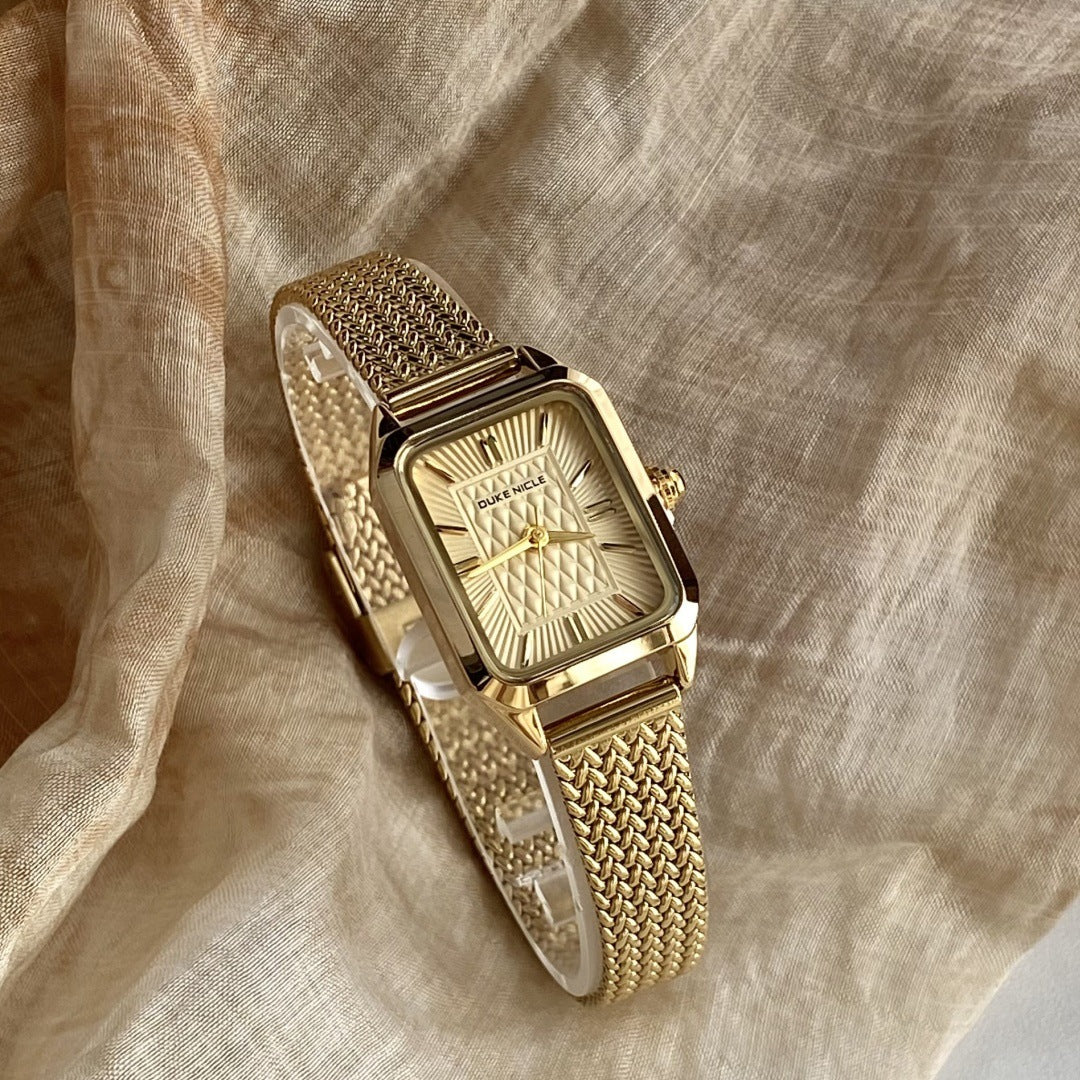 Women's vintage square quartz watch with gold-tone woven steel bracelet and champagne dial