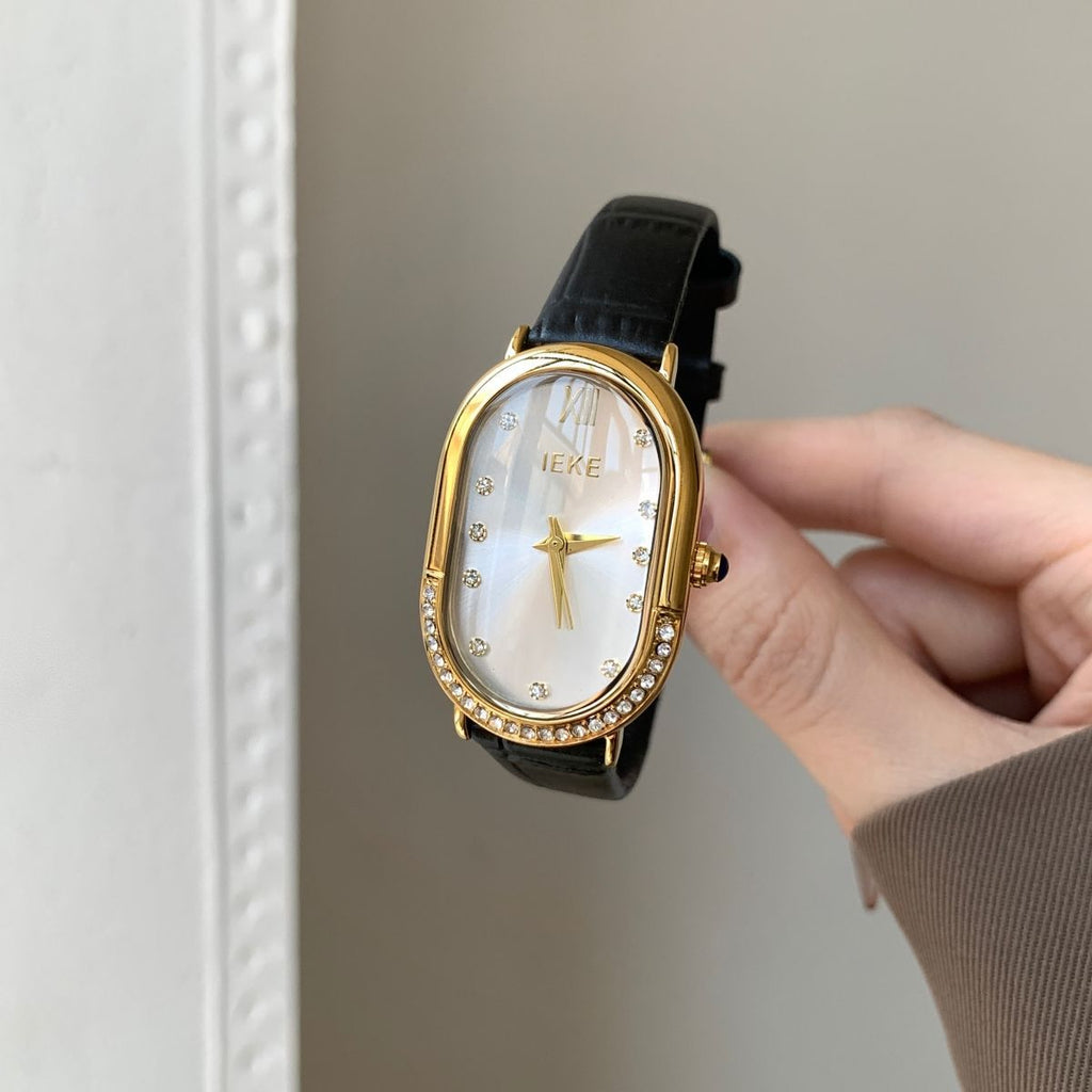 Retro Sculpted Oval Dial Watch with Slim Leather Strap - Elegant Dress Watch for Women