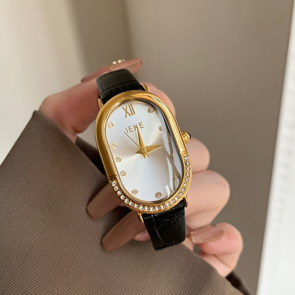 Retro Sculpted Oval Dial Watch with Slim Leather Strap - Elegant Dress Watch for Women