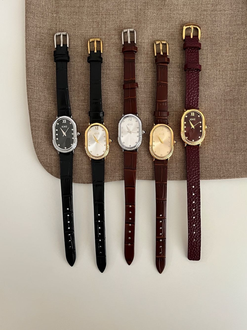 Retro Sculpted Oval Dial Watch with Slim Leather Strap - Elegant Dress Watch for Women