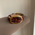 Retro Sculpted Oval Dial Watch with Slim Leather Strap - Elegant Dress Watch for Women