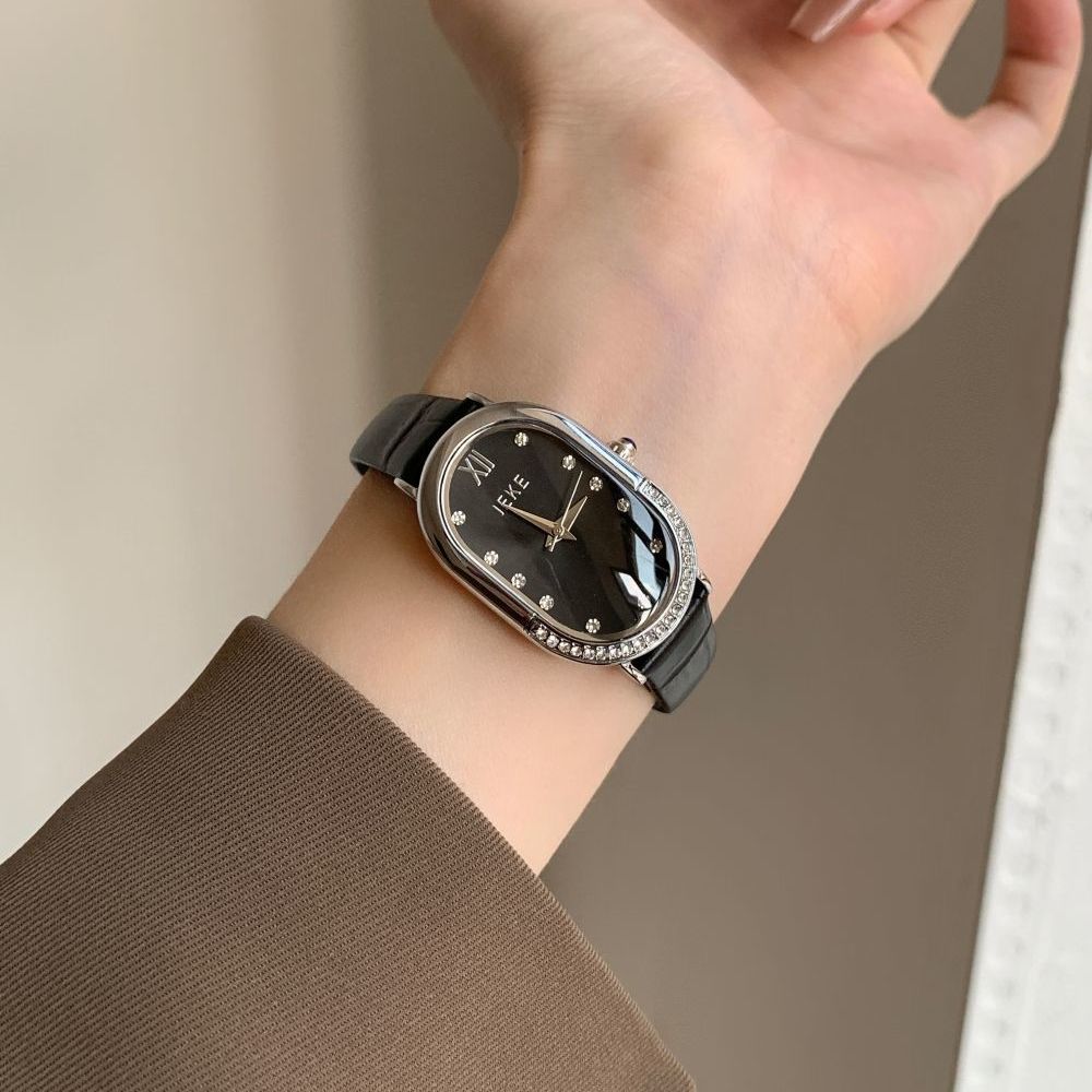 Retro Sculpted Oval Dial Watch with Slim Leather Strap - Elegant Dress Watch for Women